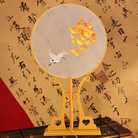 Hand-held circular fan with embroidered ginkgo and cranes